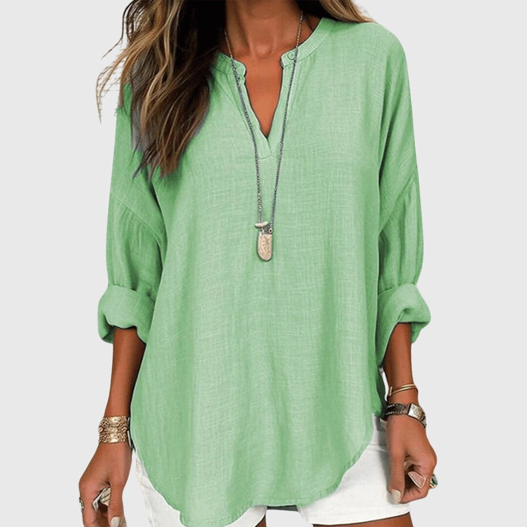 Women’s flowy beach shirt with round neck and long sleeves, ideal for beach vacations, casual summer outfits, and lightweight layering.
