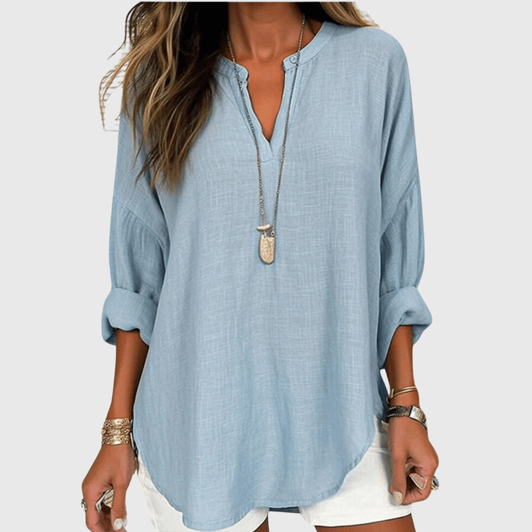 Women’s flowy beach shirt with round neck and long sleeves, ideal for beach vacations, casual summer outfits, and lightweight layering.