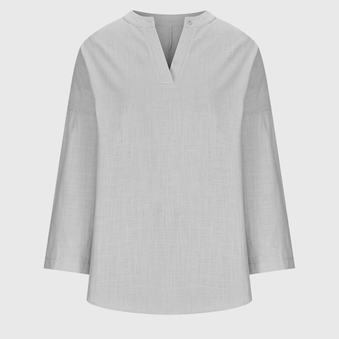 Women’s flowy beach shirt with round neck and long sleeves, ideal for beach vacations, casual summer outfits, and lightweight layering.