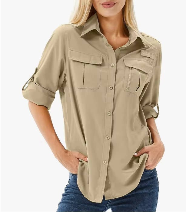 Women’s hiking shirt with roll-up sleeves, chest pockets, UPF 50 protection, and relaxed fit, suitable for hiking, camping, and outdoor activities.
