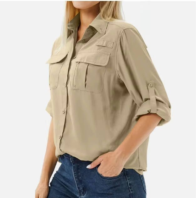 Women’s hiking shirt with roll-up sleeves, chest pockets, UPF 50 protection, and relaxed fit, suitable for hiking, camping, and outdoor activities.