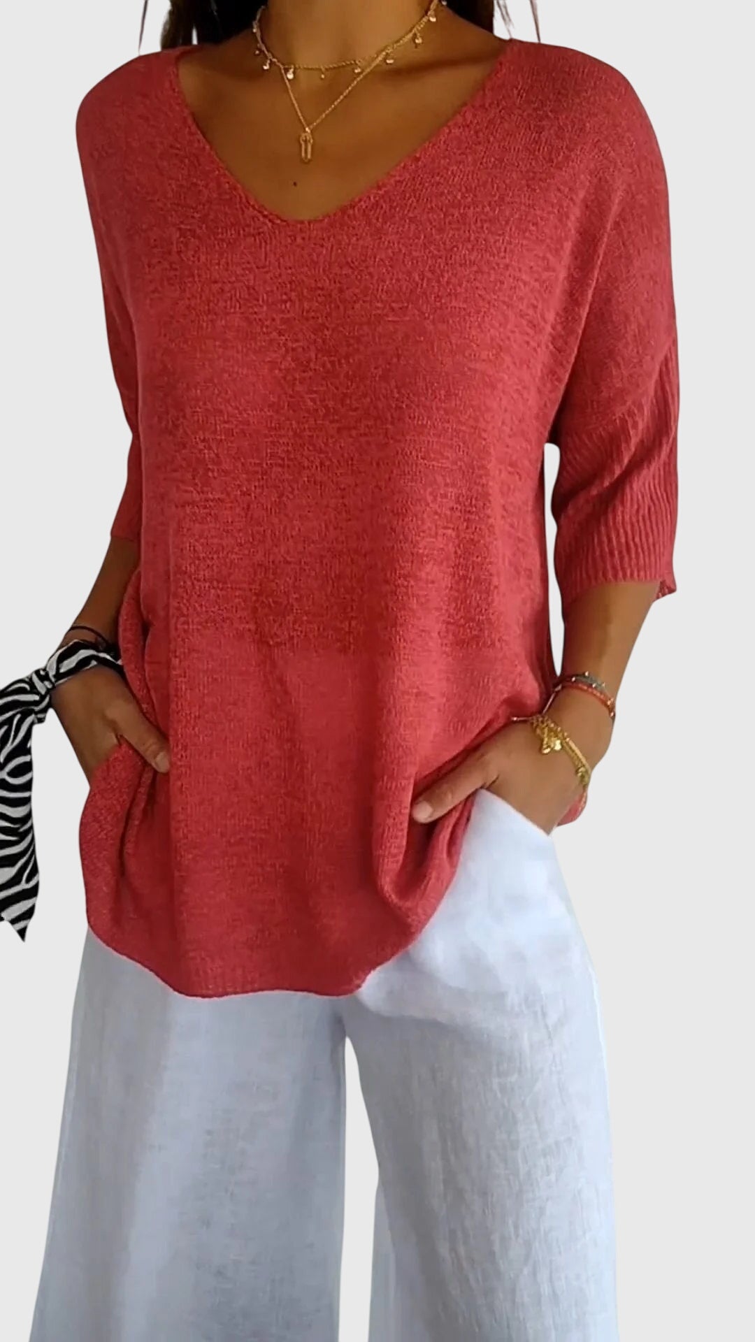 Women’s knit top with V-neckline and soft fit, ideal for layering, casual outfits, office wear, and everyday styling.