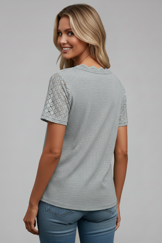 Women’s T-shirt with V-neckline and lace shoulder detailing, suitable for everyday wear and casual outfits.