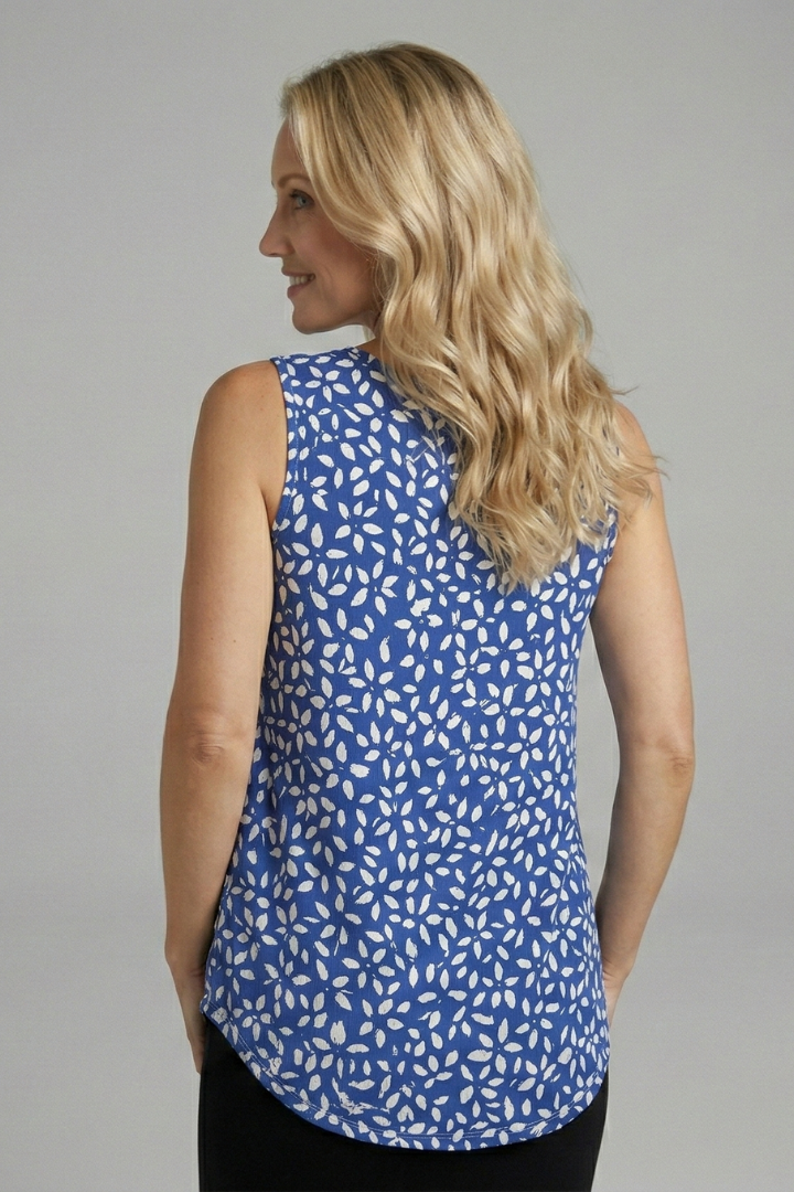 Women’s sleeveless top with V-neckline, wide straps, and leaf print, suitable for casual wear and summer outfits.