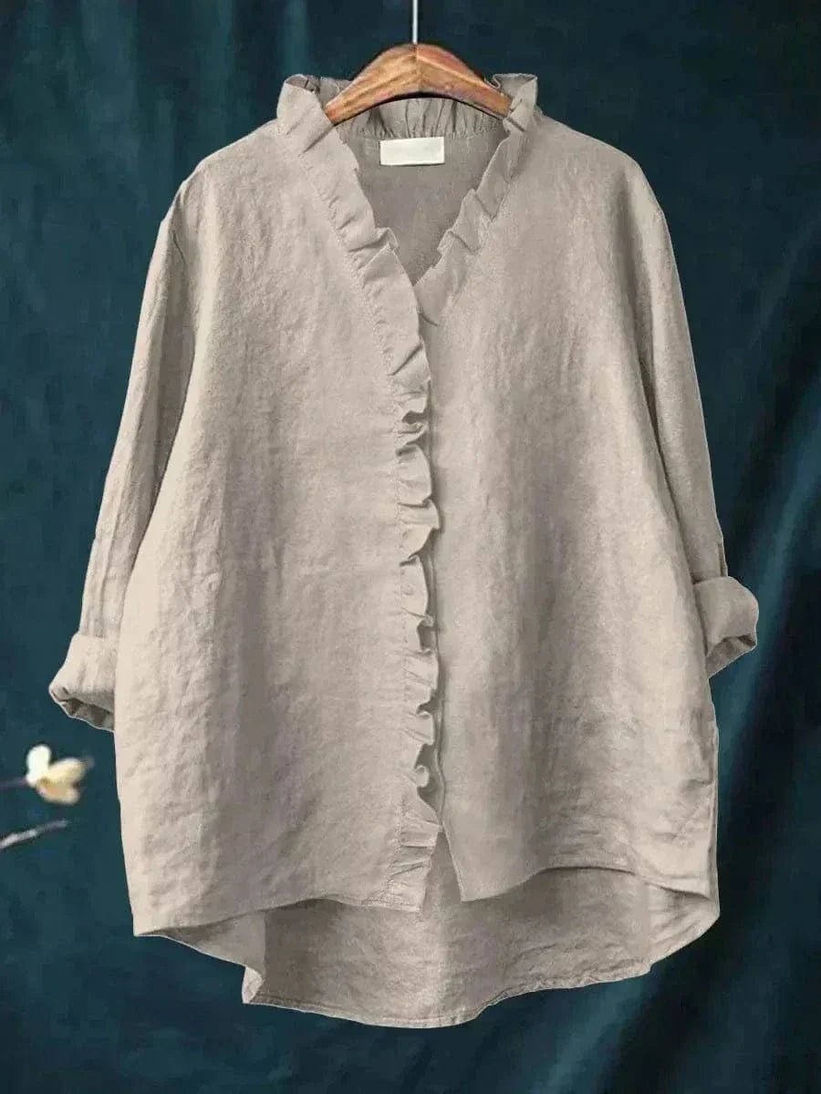Women’s linen blouse with ruffle neckline and relaxed fit, suitable for summer wear, office outfits, and casual occasions.