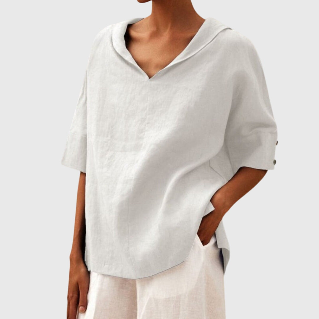 Women’s loose-fit blouse with a relaxed silhouette and versatile design, suitable for casual outfits, office wear, and everyday styling.