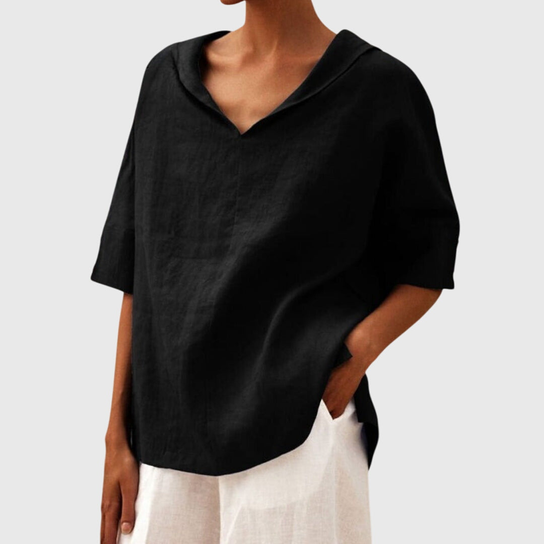 Women’s loose-fit blouse with a relaxed silhouette and versatile design, suitable for casual outfits, office wear, and everyday styling.