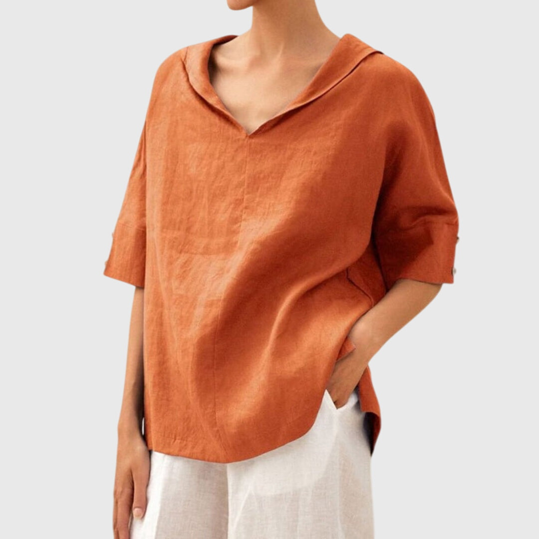 Women’s loose-fit blouse with a relaxed silhouette and versatile design, suitable for casual outfits, office wear, and everyday styling.