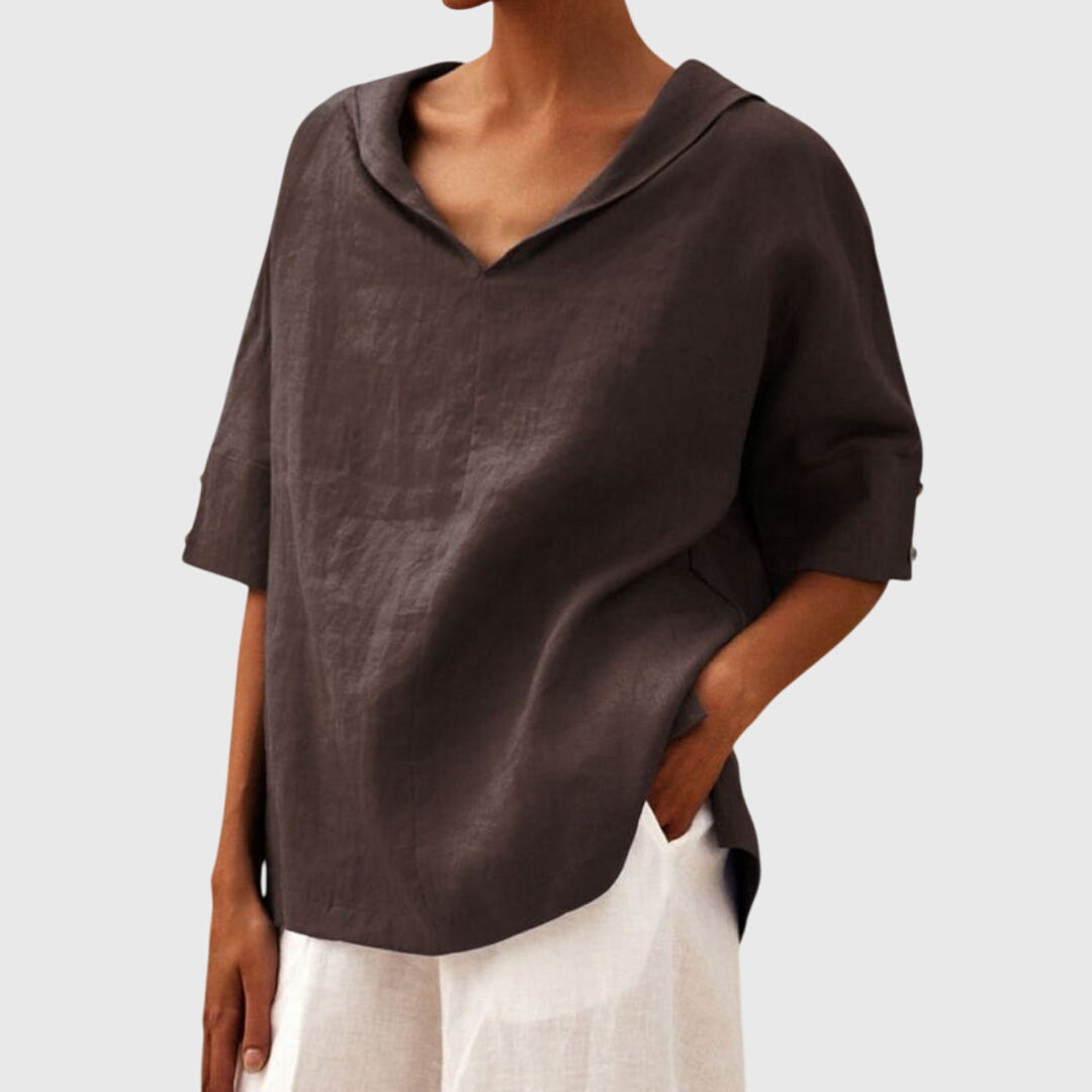 Women’s loose-fit blouse with a relaxed silhouette and versatile design, suitable for casual outfits, office wear, and everyday styling.