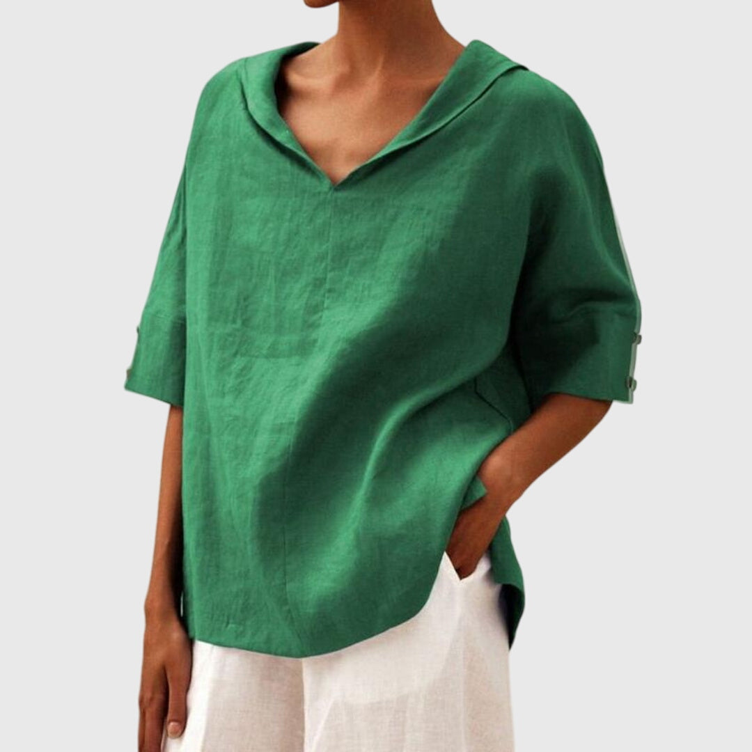Women’s loose-fit blouse with a relaxed silhouette and versatile design, suitable for casual outfits, office wear, and everyday styling.