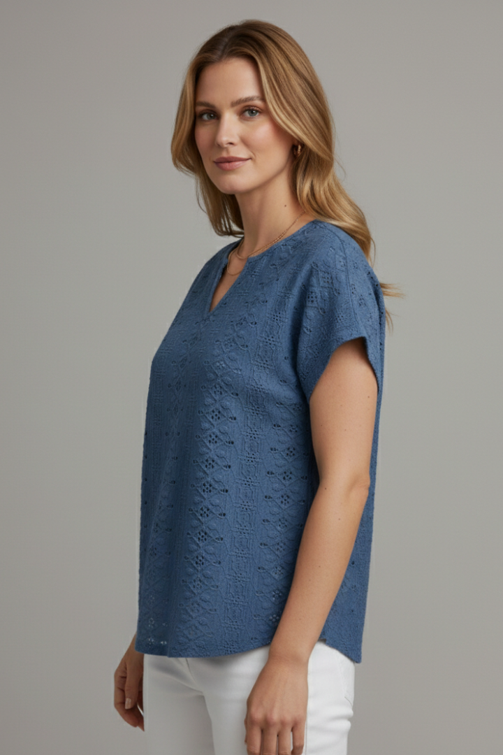 Women’s T-shirt with notched neckline and eyelet surface detailing, designed for casual wear and everyday outfits.