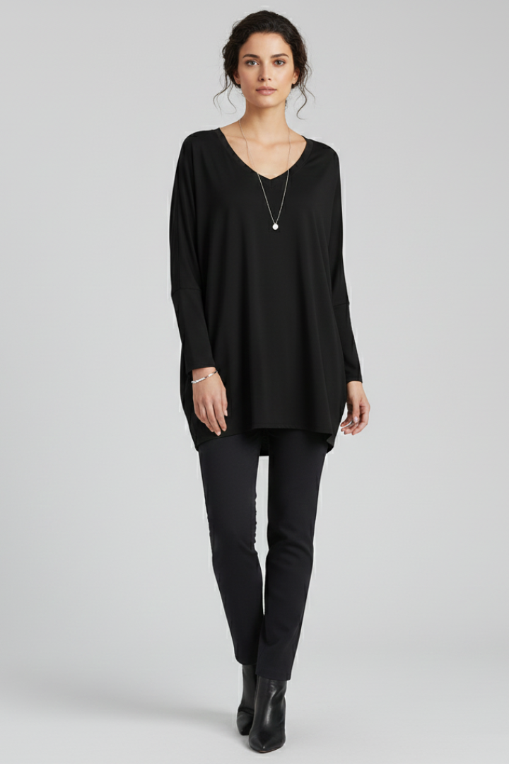 Women’s oversized V-neck shirt with long sleeves, designed for casual wear and versatile everyday outfits
