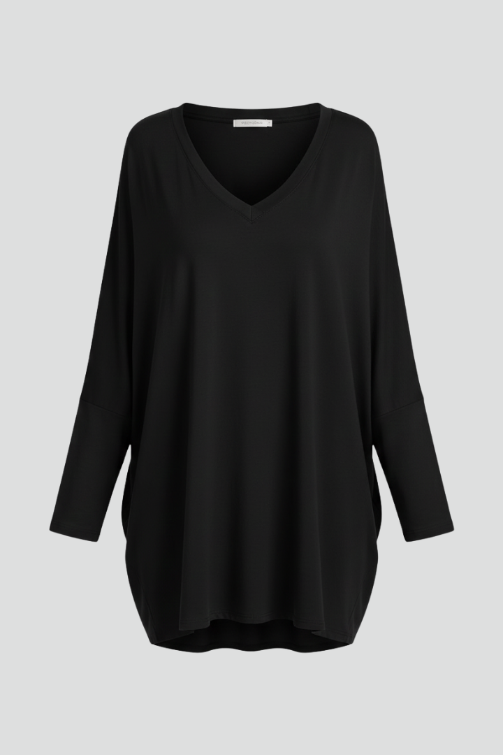 Women’s oversized V-neck shirt with long sleeves, designed for casual wear and versatile everyday outfits