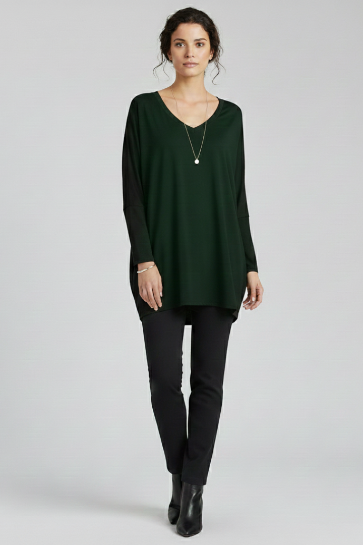 Women’s oversized V-neck shirt with long sleeves, designed for casual wear and versatile everyday outfits