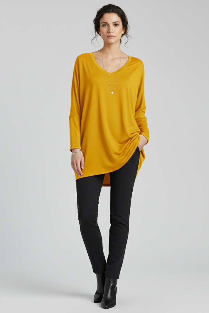 Women’s oversized V-neck shirt with long sleeves, designed for casual wear and versatile everyday outfits