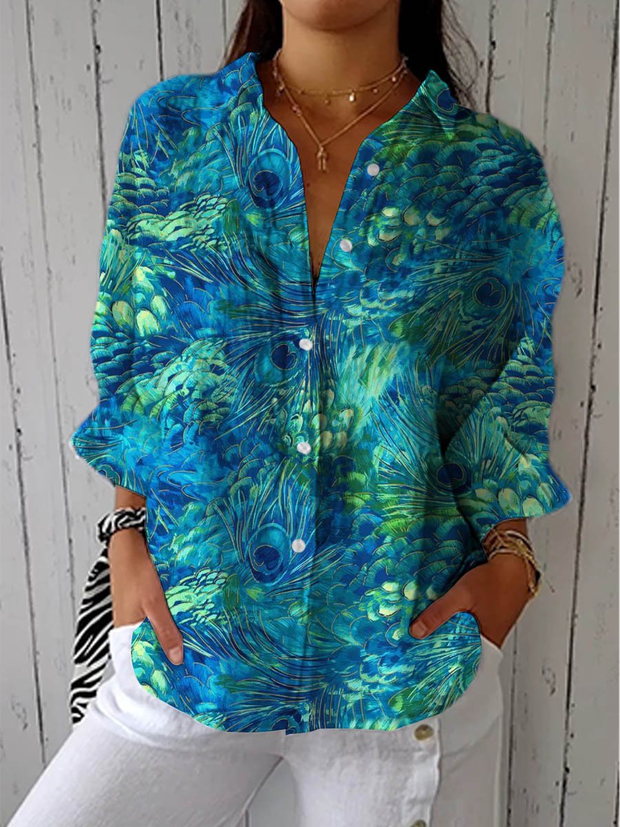 Women’s peacock print blouse with button-front closure, V-neckline, long sleeves, and relaxed fit, suitable for casual outings and smart casual styling.