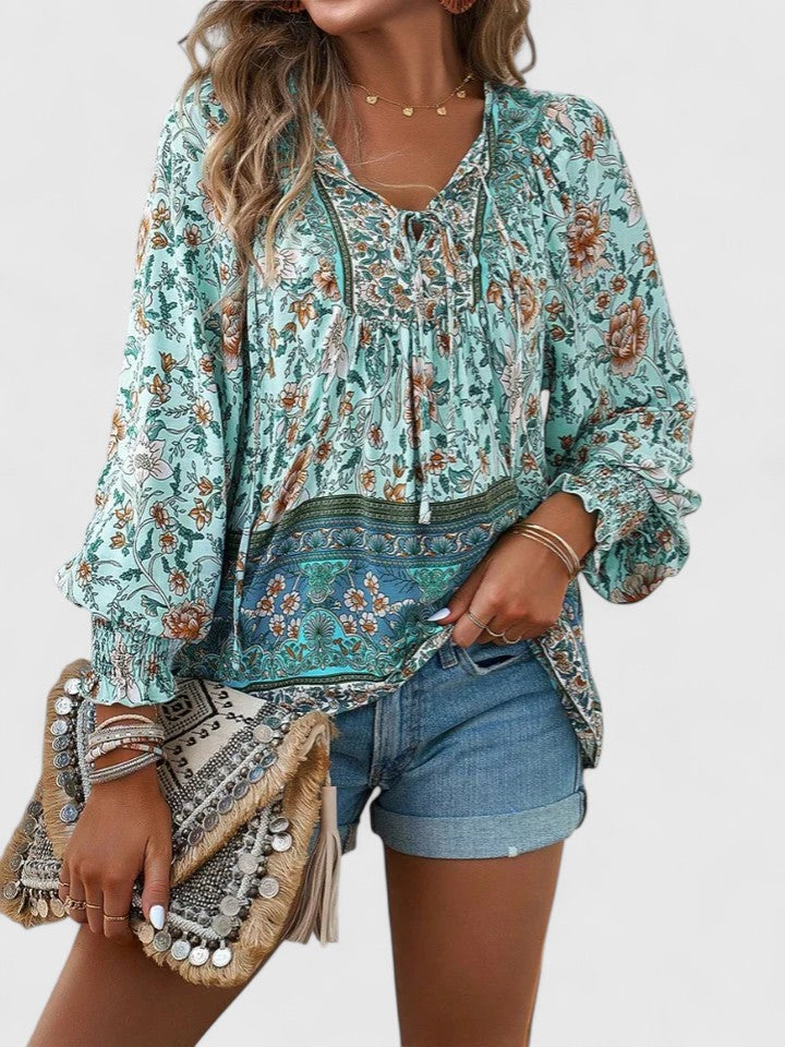 Women’s peasant top with floral print, long sleeves, and relaxed fit, suitable for casual outings, vacations, and everyday styling.