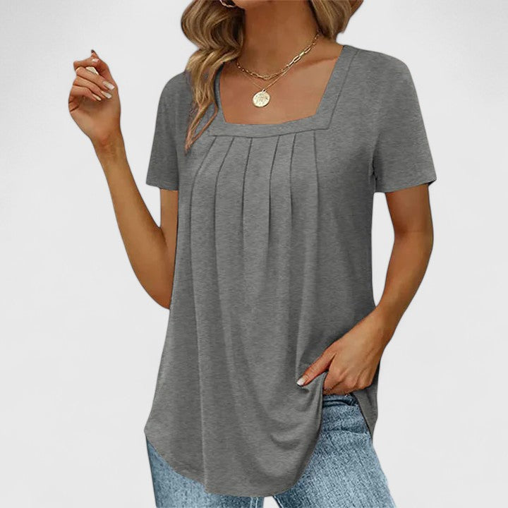 Women’s pleated blouse with a square neckline and relaxed fit, ideal for summer outfits, office wear, and smart casual occasions.