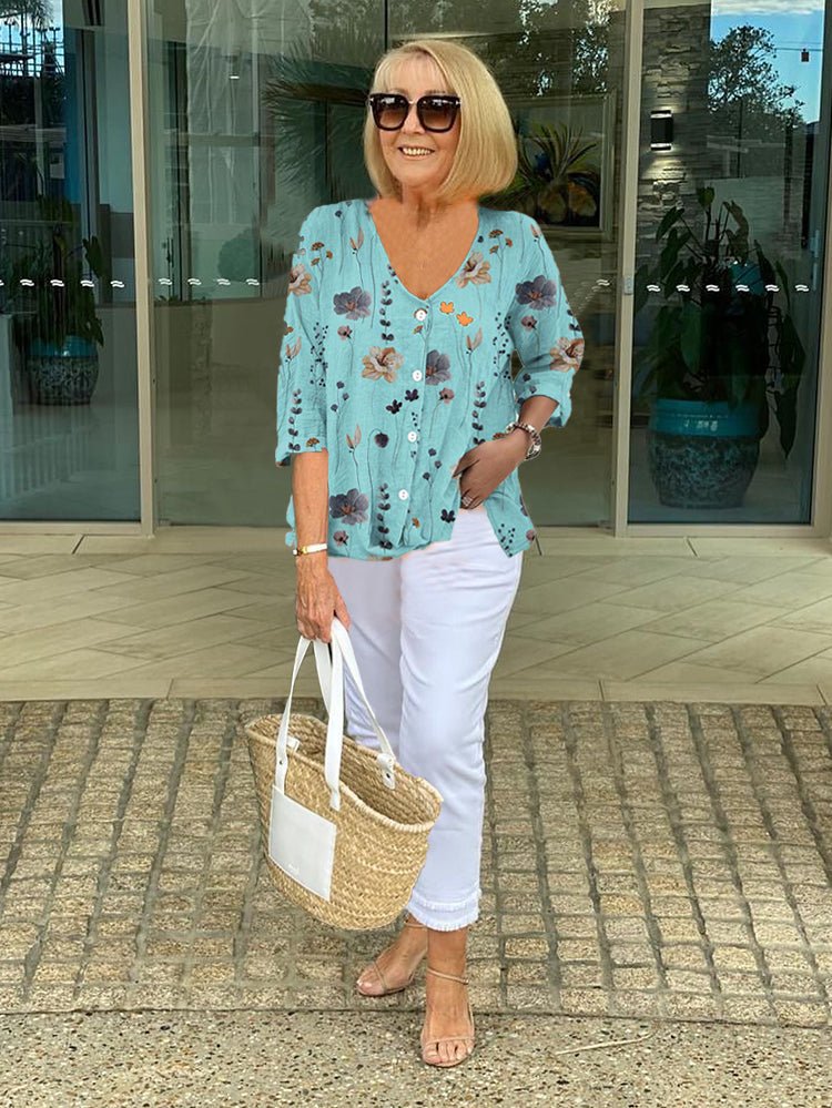 Women’s plus size floral blouse with a v-neck and relaxed fit, suitable for office outfits, casual wear, and everyday styling.