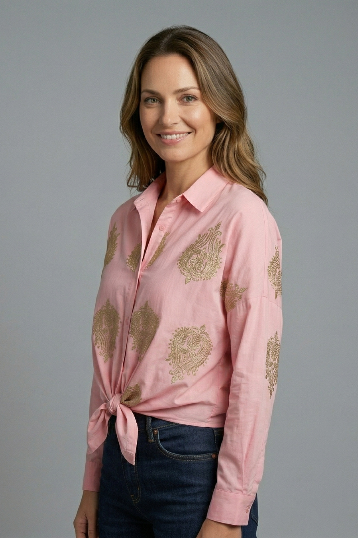 Women’s printed blouse with open neckline, button front, and long sleeves, ideal for office outfits and casual everyday styling.