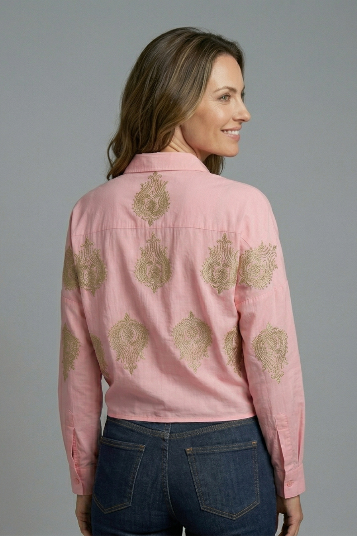 Women’s printed blouse with open neckline, button front, and long sleeves, ideal for office outfits and casual everyday styling.
