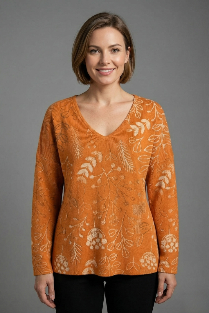 Women’s printed top with V-neckline, long sleeves, and relaxed fit, ideal for casual everyday outfits and seasonal styling.