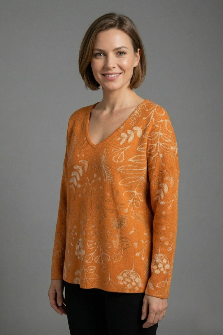Women’s printed top with V-neckline, long sleeves, and relaxed fit, ideal for casual everyday outfits and seasonal styling.