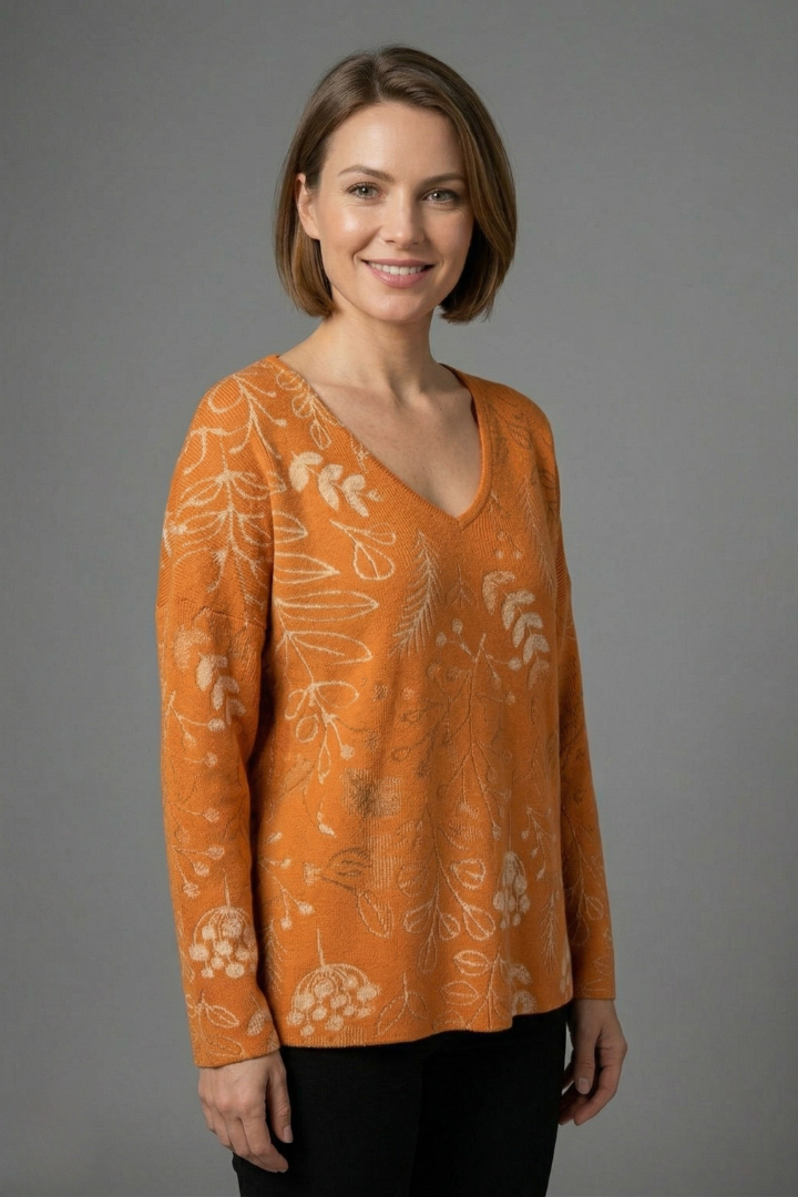 Women’s printed top with V-neckline, long sleeves, and relaxed fit, ideal for casual everyday outfits and seasonal styling.