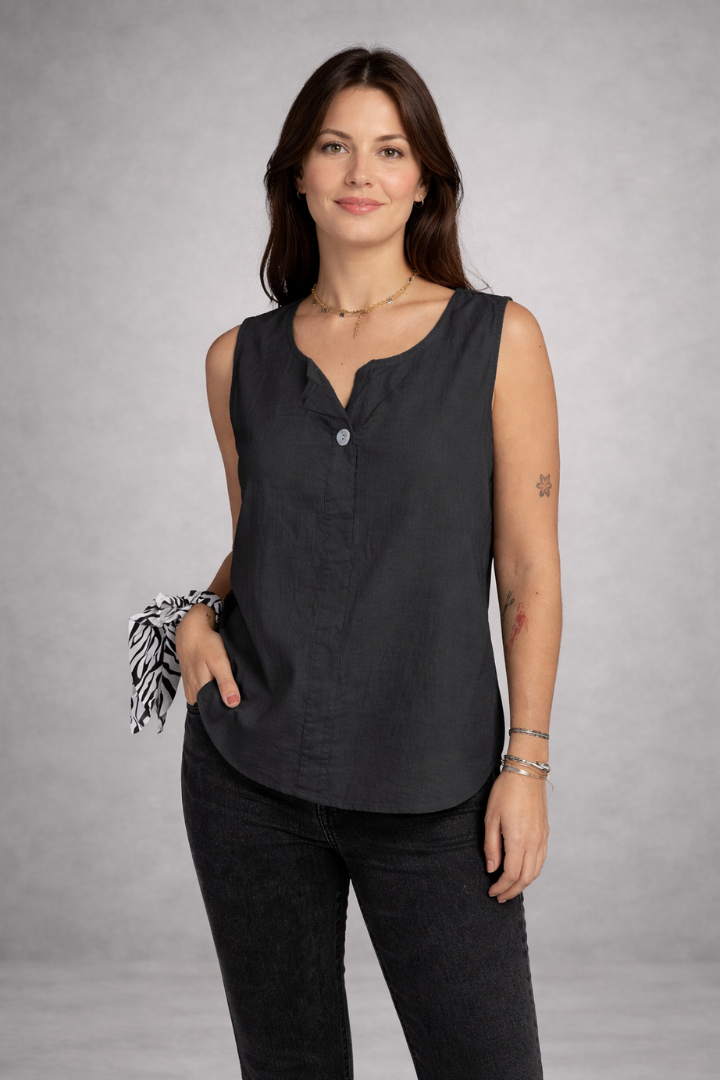 Women’s sleeveless blouse with round neckline and front button detail, suitable for casual wear and office outfits