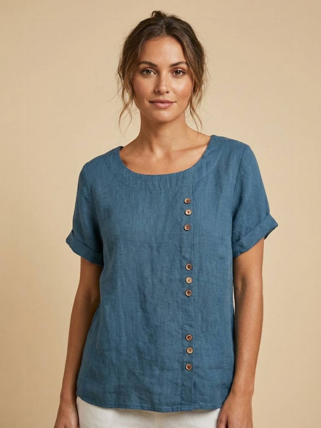 Women’s round neck blouse with button detailing and a relaxed fit, suitable for summer outfits, casual wear, and everyday styling.