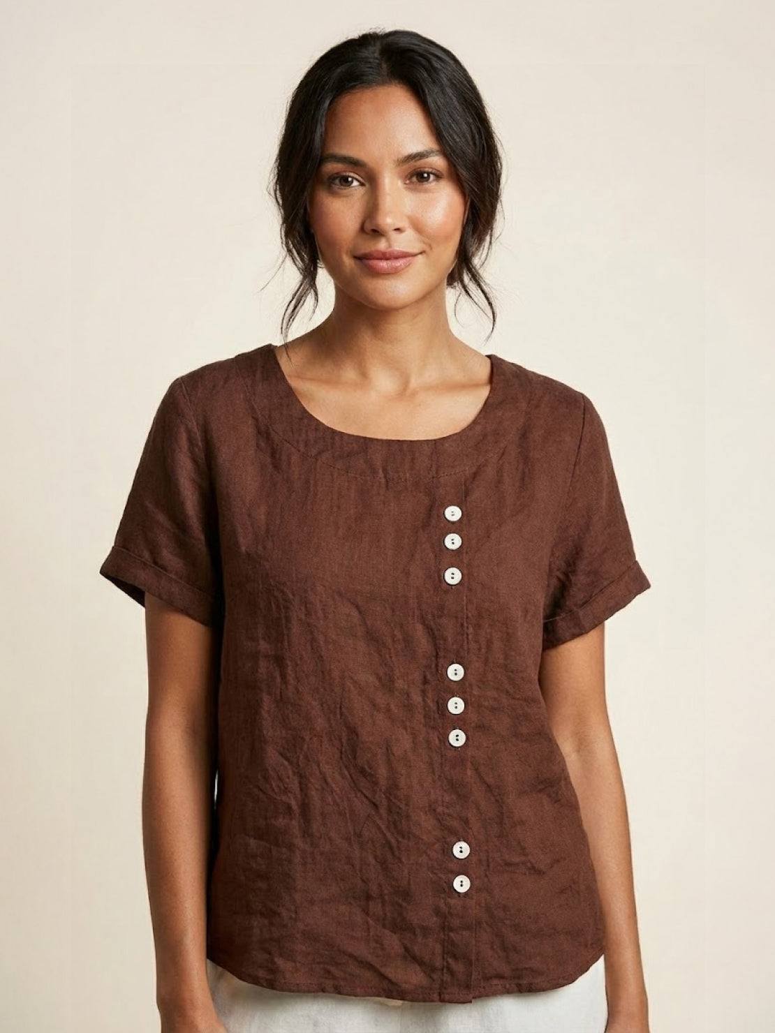 Women’s round neck blouse with button detailing and a relaxed fit, suitable for summer outfits, casual wear, and everyday styling.