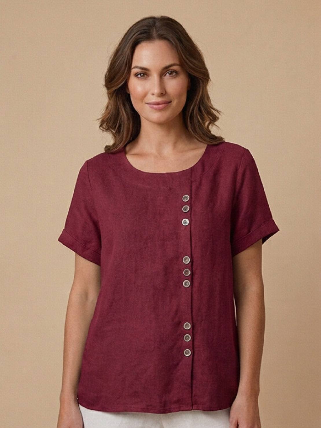 Women’s round neck blouse with button detailing and a relaxed fit, suitable for summer outfits, casual wear, and everyday styling.