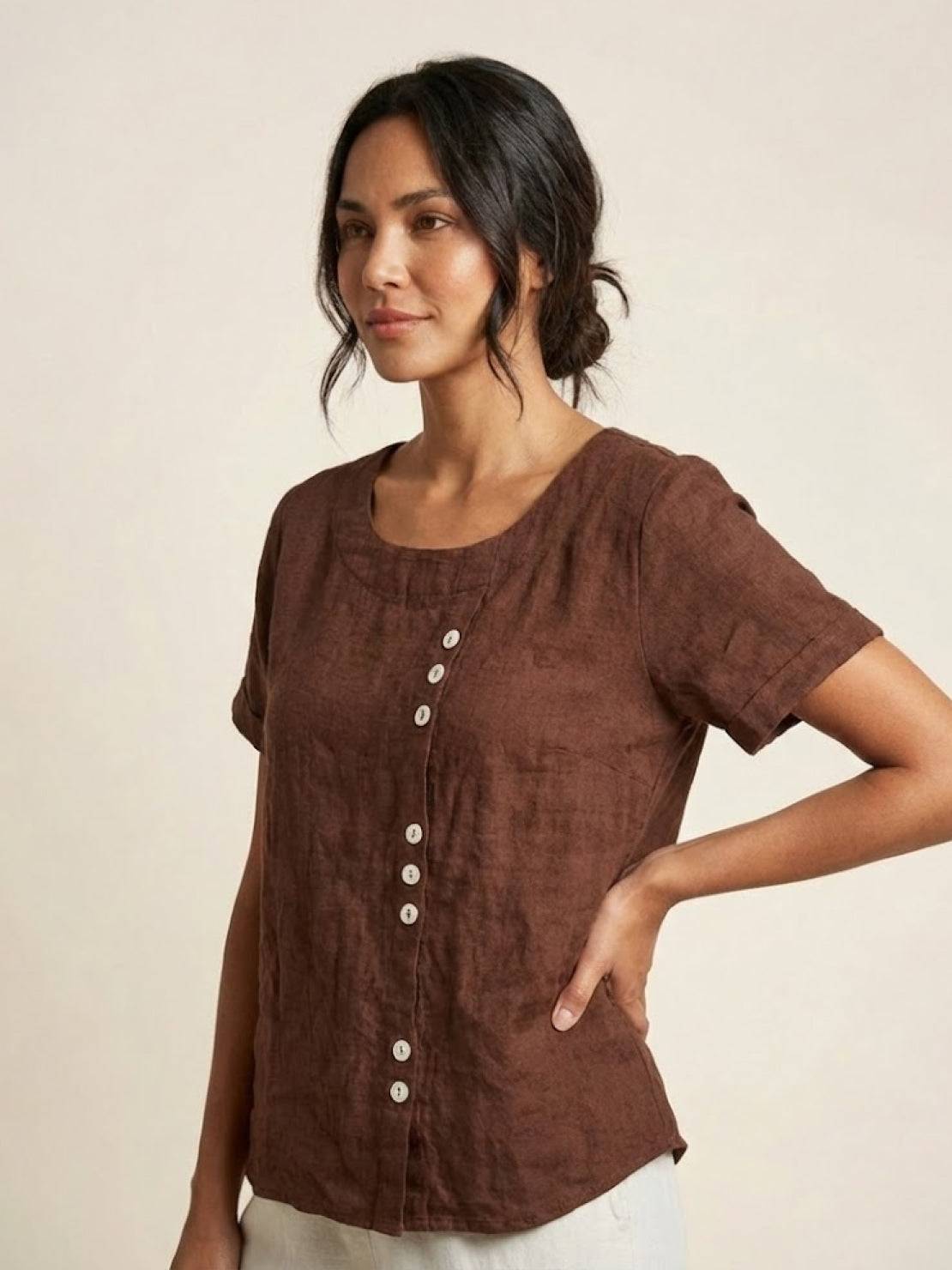 Women’s round neck blouse with button detailing and a relaxed fit, suitable for summer outfits, casual wear, and everyday styling.