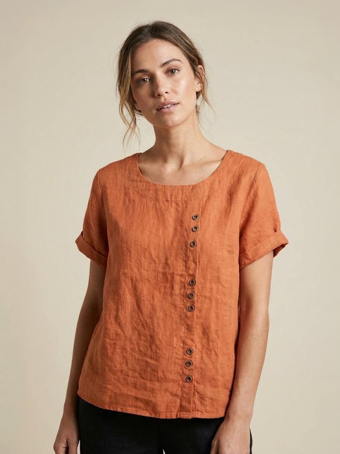 Women’s round neck blouse with button detailing and a relaxed fit, suitable for summer outfits, casual wear, and everyday styling.