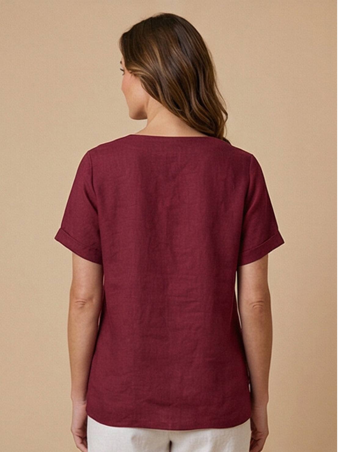 Women’s round neck blouse with button detailing and a relaxed fit, suitable for summer outfits, casual wear, and everyday styling.