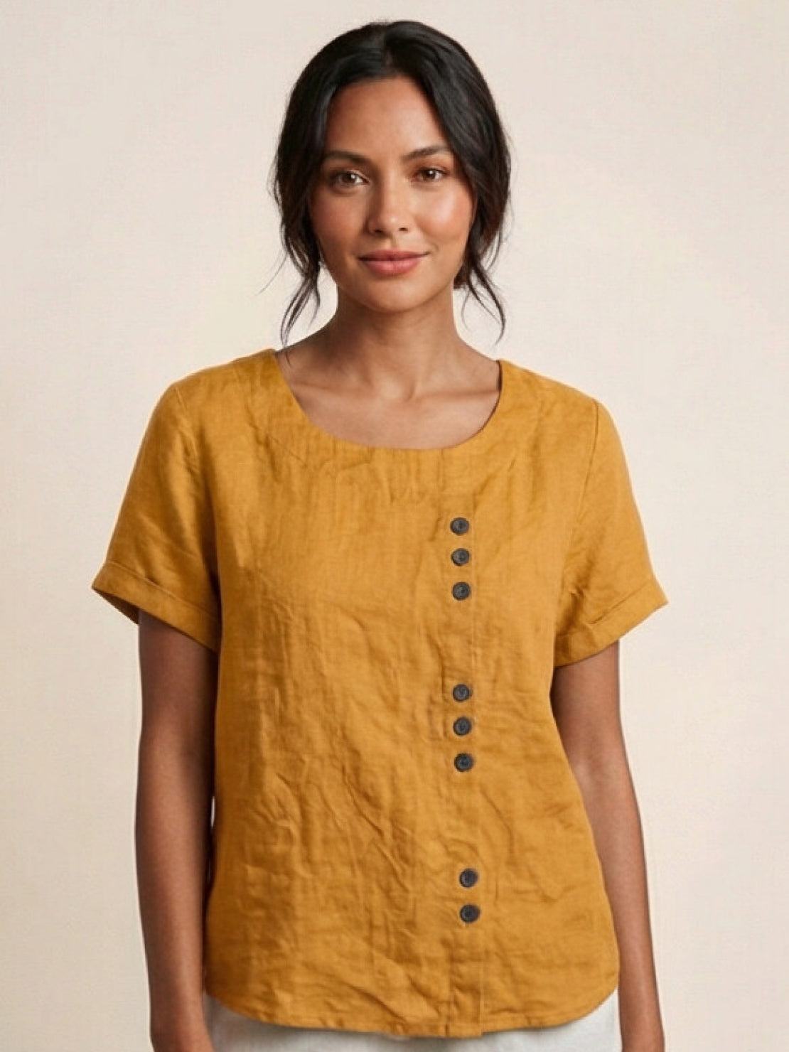 Women’s round neck blouse with button detailing and a relaxed fit, suitable for summer outfits, casual wear, and everyday styling.