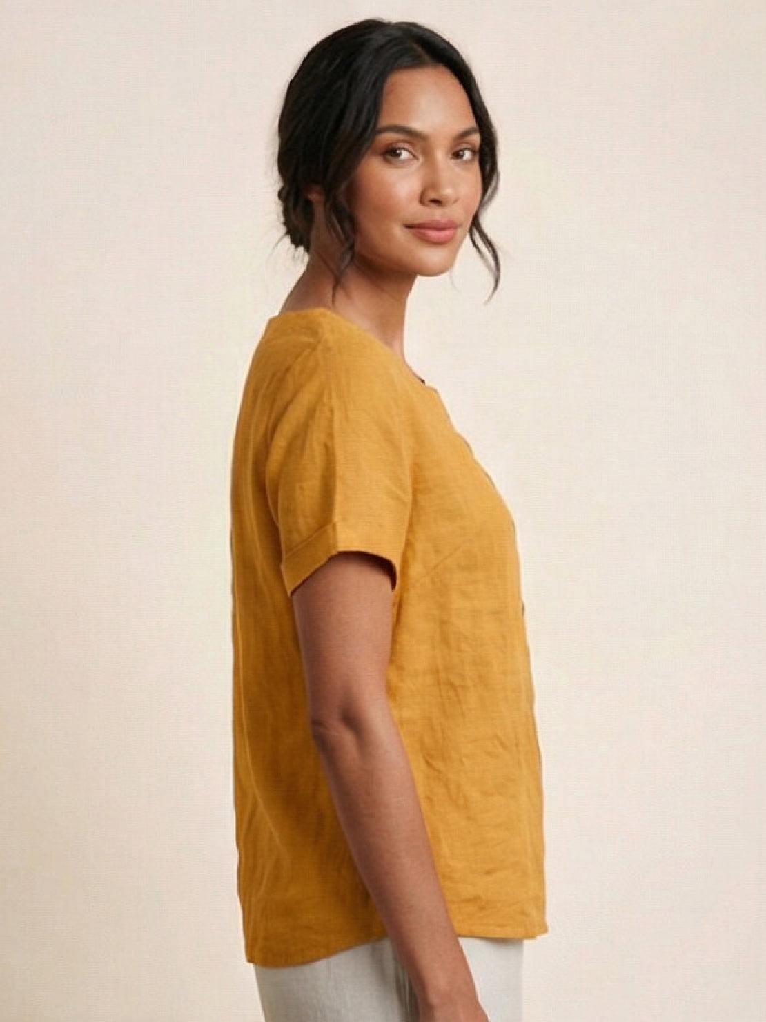 Women’s round neck blouse with button detailing and a relaxed fit, suitable for summer outfits, casual wear, and everyday styling.