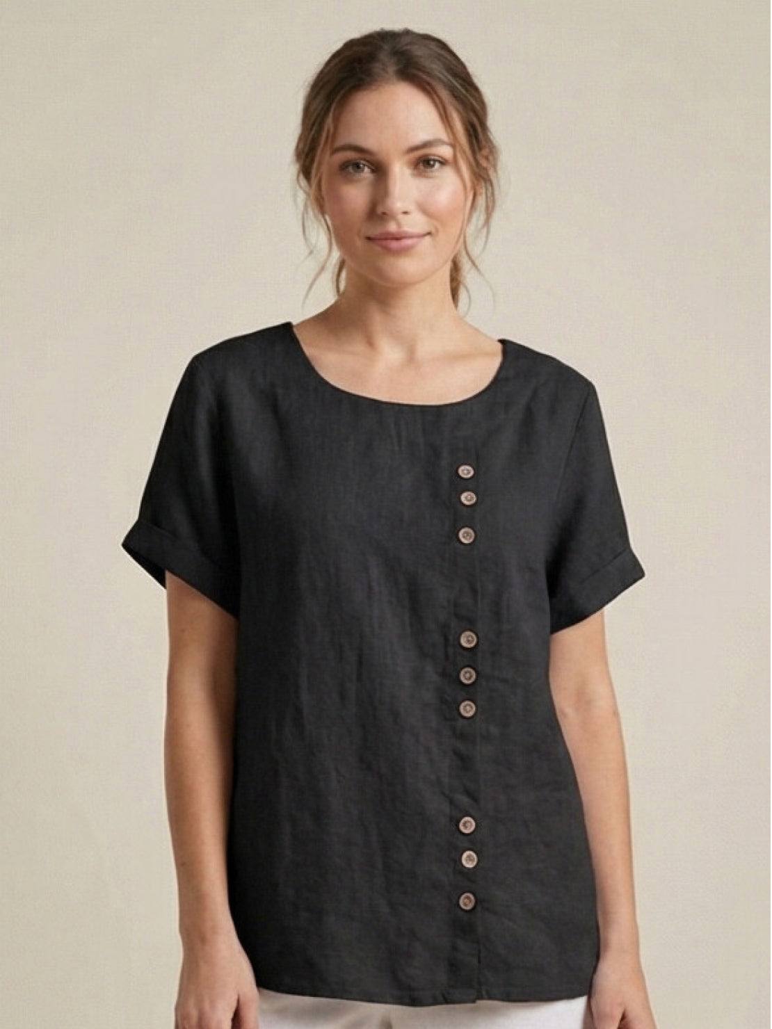 Women’s round neck blouse with button detailing and a relaxed fit, suitable for summer outfits, casual wear, and everyday styling.