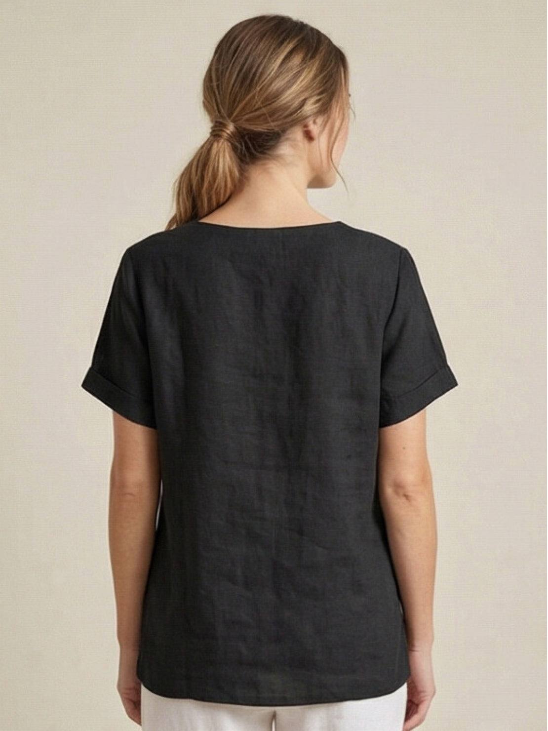 Women’s round neck blouse with button detailing and a relaxed fit, suitable for summer outfits, casual wear, and everyday styling.