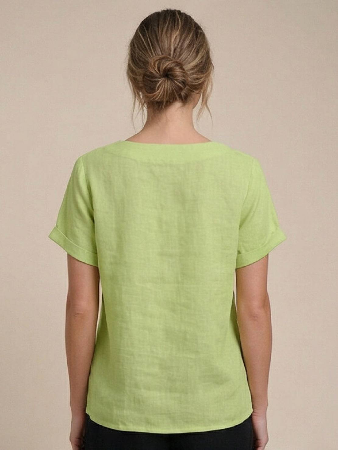 Women’s round neck blouse with button detailing and a relaxed fit, suitable for summer outfits, casual wear, and everyday styling.