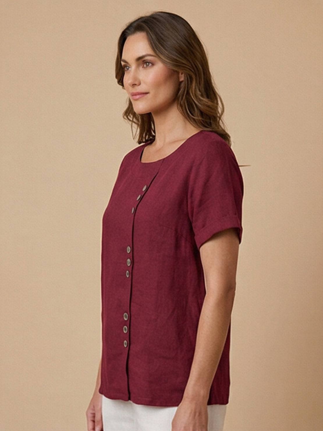 Women’s round neck blouse with button detailing and a relaxed fit, suitable for summer outfits, casual wear, and everyday styling.