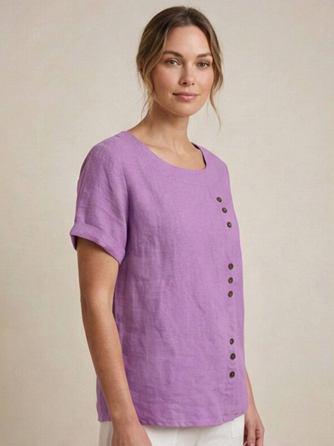 Women’s round neck blouse with button detailing and a relaxed fit, suitable for summer outfits, casual wear, and everyday styling.