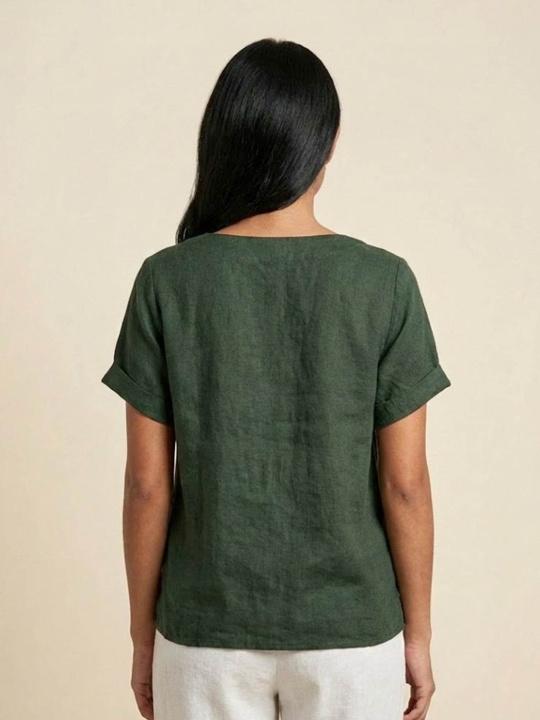 Women’s round neck blouse with button detailing and a relaxed fit, suitable for summer outfits, casual wear, and everyday styling.