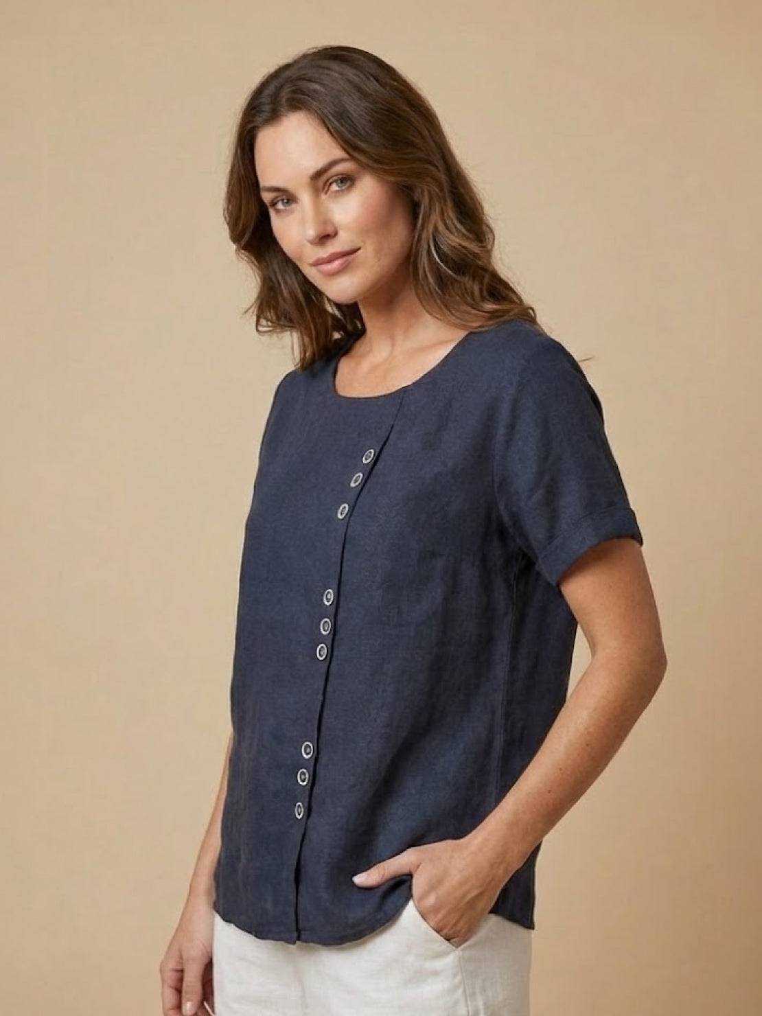 Women’s round neck blouse with button detailing and a relaxed fit, suitable for summer outfits, casual wear, and everyday styling.