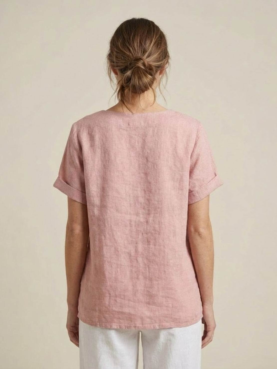 Women’s round neck blouse with button detailing and a relaxed fit, suitable for summer outfits, casual wear, and everyday styling.