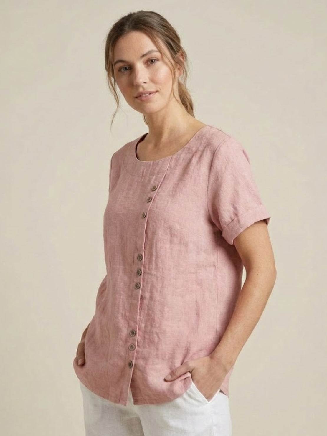 Women’s round neck blouse with button detailing and a relaxed fit, suitable for summer outfits, casual wear, and everyday styling.