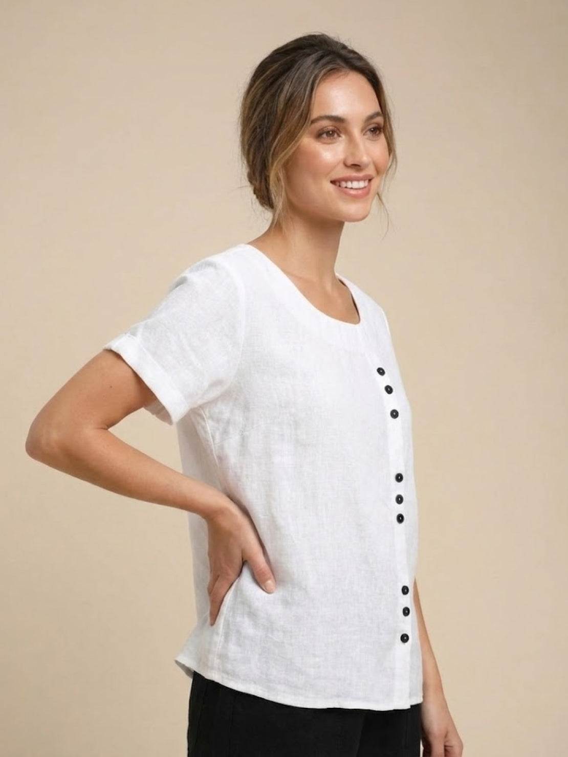 Women’s round neck blouse with button detailing and a relaxed fit, suitable for summer outfits, casual wear, and everyday styling.