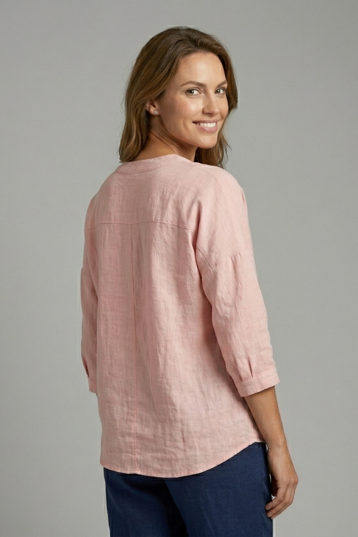 Women’s blouse with round neckline, front button closure, and long sleeves, ideal for office wear and casual everyday outfits.
