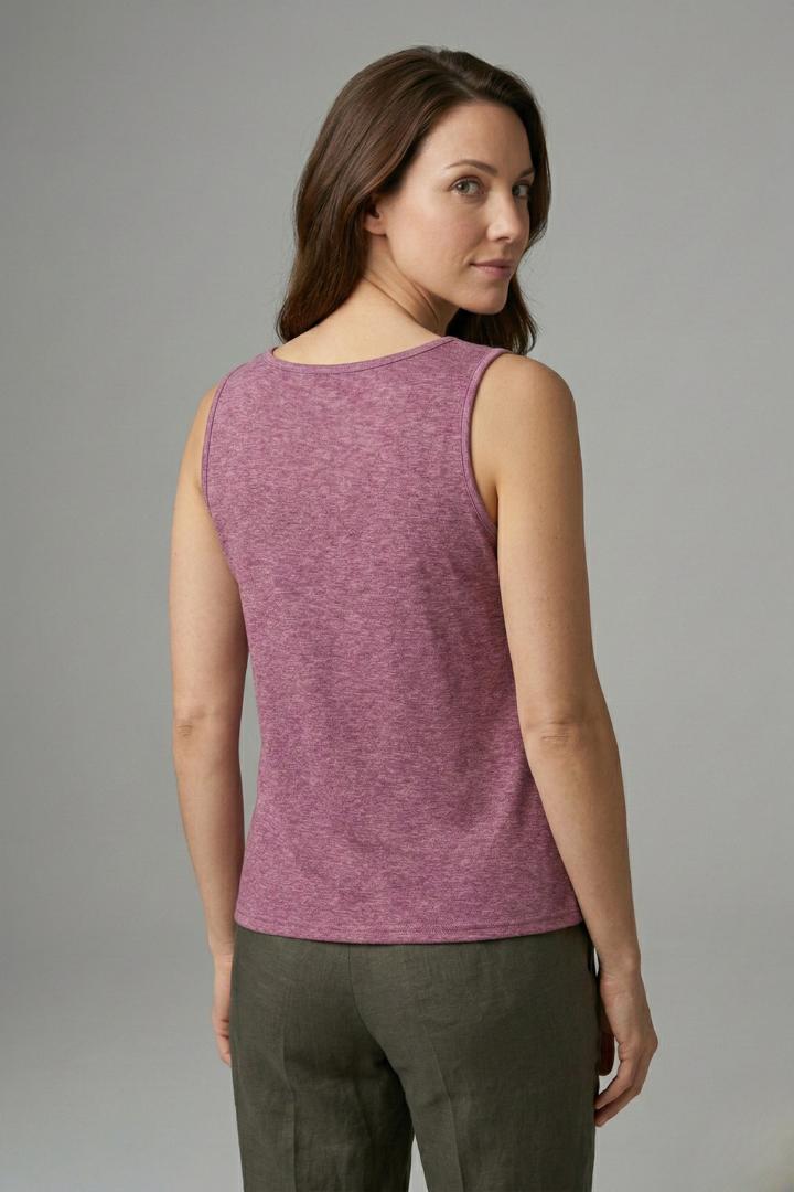 Women’s sleeveless top with round neckline and decorative front buttons, suitable for casual wear and office outfits