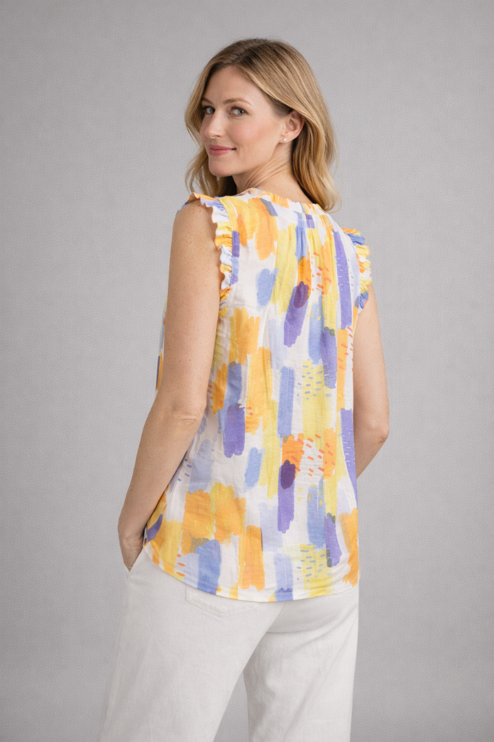 Women’s sleeveless top with ruffle collar and abstract print, designed for casual wear and summer outfits